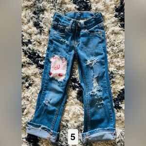 Distressed Blue Jeans with strawberry Patch